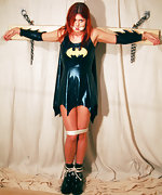 Superheroine is crucified and cleave-gagged